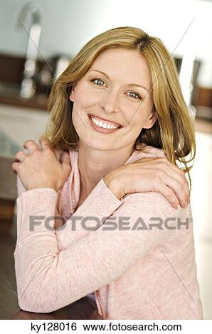 Stock Photograph - Woman smiling for the camera. Fotosearch