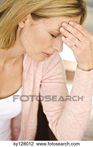 Woman with hand on forehead, eyes closed View Large Photo Image Stock Image - Woman with hand on forehead, eyes closed. Fotosearch