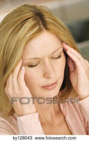 Woman with hands on temples, eyes closed View Large Photo Image Stock Image - Woman with hands on temples, eyes closed. Fotosearch