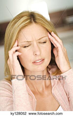 Woman with hands on temples, eyes closed View Large Photo Image Stock Image - Woman with hands on temples, eyes closed. Fotosearch