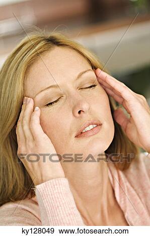 Woman with hands on temples, eyes closed View Large Photo Image Stock Photo - Woman with hands on temples, eyes closed. Fotosearch