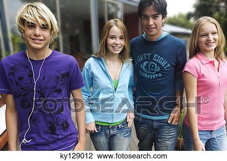 2 teenage boys and 2 teenage girls smiling for camera View Large Photo Image Stock Image - 2 teenage boys and 2 teenage girls smiling for camera. Fotosearch