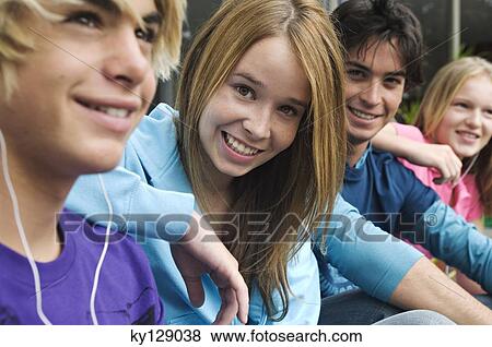 2 teenage boys and 2 teenage girls smiling for camera View Large Photo Image Stock Photo - 2 teenage boys and 2 teenage girls smiling for camera. Fotosearch