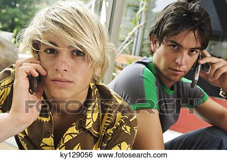 2 teenage boys using mobile phone View Large Photo Image Stock Photograph - 2 teenage boys using mobile phone. Fotosearch