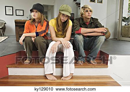 2 teenage girls and 1 teenage boy looking sullen View Large Photo Image Stock Image - 2 teenage girls and 1 teenage boy looking sullen. Fotosearch