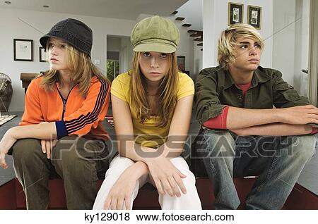 2 teenage girls and 1 teenage boy looking sullen View Large Photo Image Stock Photo - 2 teenage girls and 1 teenage boy looking sullen. Fotosearch