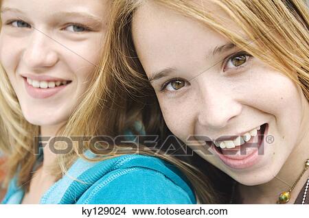 Portrait of 2 smiling teenage girls View Large Photo Image Picture - Portrait of 2 smiling teenage girls. Fotosearch