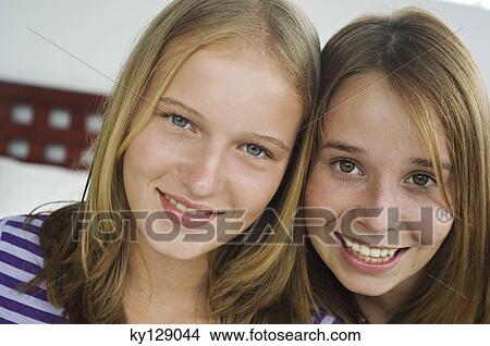 Portrait of 2 smiling teenage girls View Large Photo Image Picture - Portrait of 2 smiling teenage girls. Fotosearch