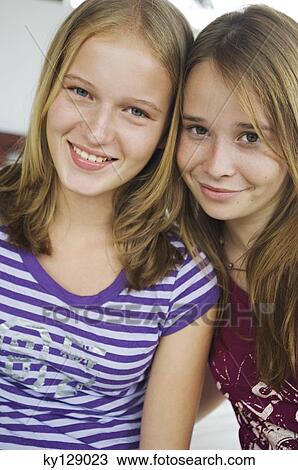 Portrait of 2 smiling teenage girls View Large Photo Image Stock Image - Portrait of 2 smiling teenage girls. Fotosearch