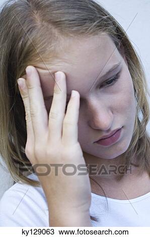 Portrait of a sad teenage girl View Large Photo Image Stock Image - Portrait of a sad teenage girl. Fotosearch