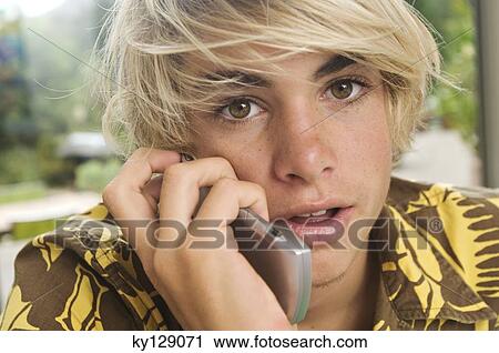 Portrait of a teenage boy using mobile phone View Large Photo Image Stock Image - Portrait of a teenage boy using mobile phone. Fotosearch
