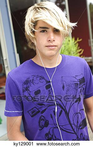Stock Image - Portrait of a teenage boy with earphones. Fotosearch