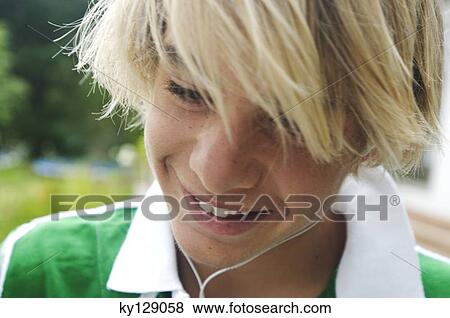 Portrait of a teenage boy with earphones View Large Photo Image Stock Photo - Portrait of a teenage boy with earphones. Fotosearch