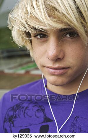 Stock Photography - Portrait of a teenage boy with earphones. Fotosearch