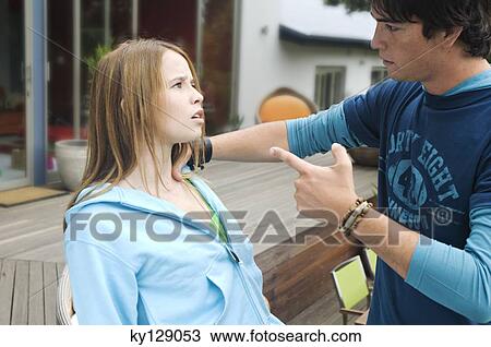 Teenage boy scolding teenage girl View Large Photo Image Stock Image - Teenage boy scolding teenage girl. Fotosearch