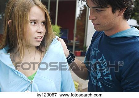Teenage boy scolding teenage girl View Large Photo Image Stock Photo - Teenage boy scolding teenage girl. Fotosearch
