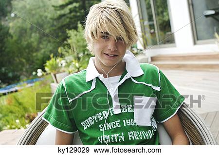 Teenage boy with earphones View Large Photo Image Stock Photo - Teenage boy with earphones. Fotosearch