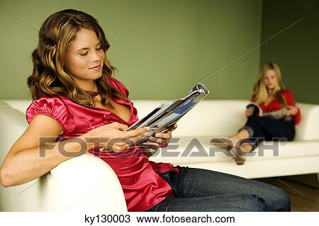 2 women reading on sofa View Large Photo Image Stock Image - 2 women reading on sofa. Fotosearch