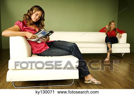 2 women reading on sofa View Large Photo Image Stock Image - 2 women reading on sofa. Fotosearch