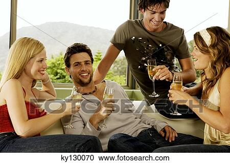 2 young couples drinking champagne View Large Photo Image Stock Image - 2 young couples drinking champagne. Fotosearch