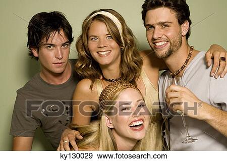 2 young couples smiling for the camera View Large Photo Image Stock Photo - 2 young couples smiling for the camera. Fotosearch