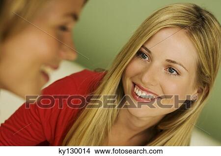 Portrait of 2 young smiling women View Large Photo Image Picture - Portrait of 2 young smiling women. Fotosearch