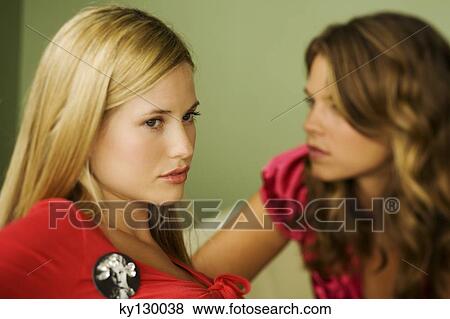 Stock Photo - Portrait of 2 young women. Fotosearch