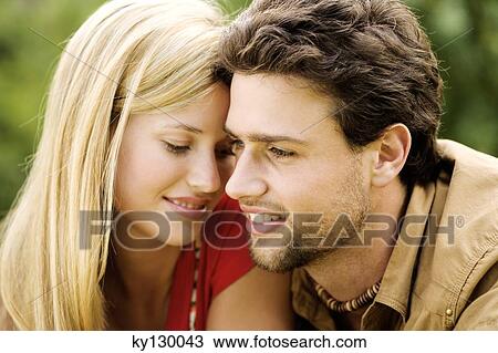 Portrait of a young couple in love View Large Photo Image Stock Image - Portrait of a young couple in love. Fotosearch