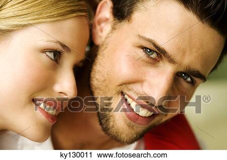 Portrait of a young smiling couple View Large Photo Image Stock Image - Portrait of a young smiling couple. Fotosearch