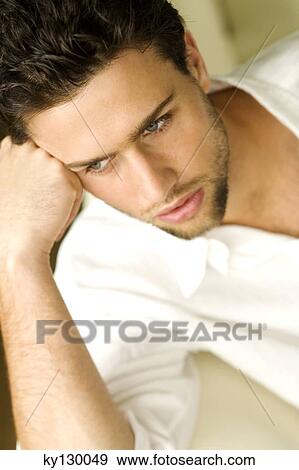 Portrait of a young thinking man View Large Photo Image Stock Photo - Portrait of a young thinking man. Fotosearch