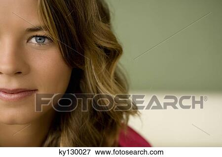 portrait of a young woman looking at the camera View Large Photo Image Stock Photo - portrait of a young woman looking at the camera. Fotosearch