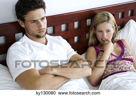 Young couple in bed View Large Photo Image Stock Image - Young couple in bed. Fotosearch