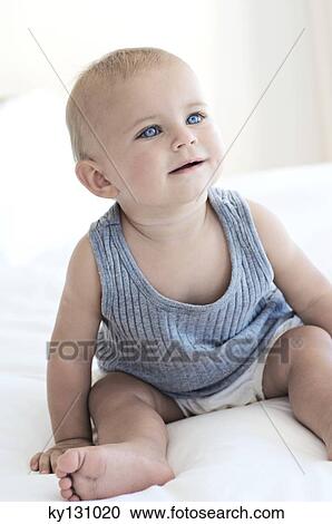 Baby sitting, indoors View Large Photo Image Stock Image - Baby sitting, indoors. Fotosearch