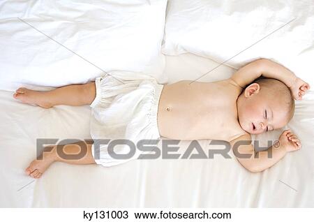 Stock Image - Baby sleeping, indoors. Fotosearch