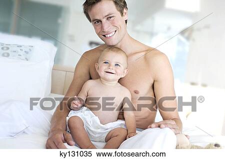 Father and baby smiling, indoors View Large Photo Image Stock Photography - Father and baby smiling, indoors. Fotosearch