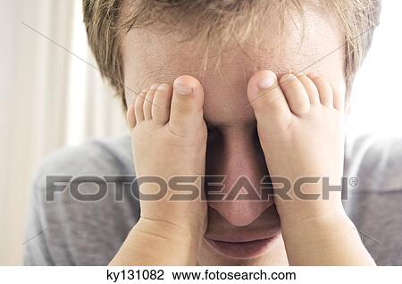 Father playing with his baby, feet on his eyes, indoors View Large Photo Image Stock Image - Father playing with his baby, feet on his eyes, indoors. Fotosearch