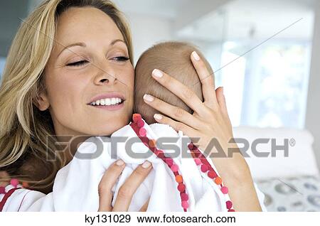 Portrait mother and baby, indoors View Large Photo Image Stock Photo - Portrait mother and baby, indoors. Fotosearch
