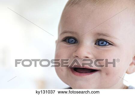 Portrait of a baby smiling, indoors View Large Photo Image Stock Photo - Portrait of a baby smiling, indoors. Fotosearch