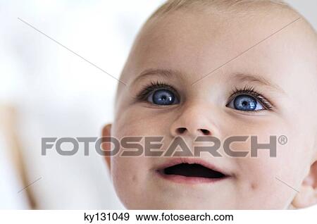 Portrait of a baby smiling, indoors View Large Photo Image Stock Photo - Portrait of a baby smiling, indoors. Fotosearch