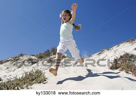 Little girl running on the beach, outdoors View Large Photo Image Stock Photo - Little girl running on the beach, outdoors. Fotosearch