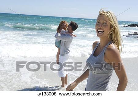 Parents and daughter on the beach, outdoors View Large Photo Image Stock Photo - Parents and daughter on the beach, outdoors. Fotosearch