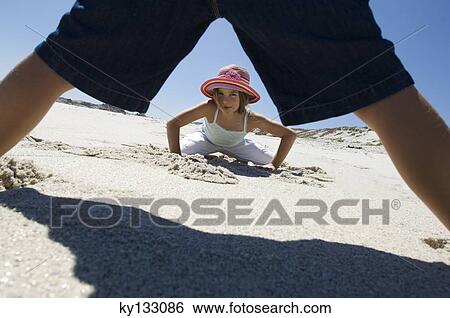 Two children playing on the beach, outdoors View Large Photo Image Stock Photograph - Two children playing on the beach, outdoors. Fotosearch