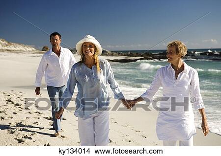 Couple and senior woman on the beach View Large Photo Image Picture - Couple and senior woman on the beach. Fotosearch