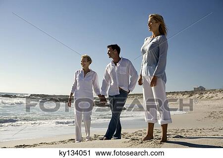 Couple and senior woman on the beach View Large Photo Image Stock Image - Couple and senior woman on the beach. Fotosearch