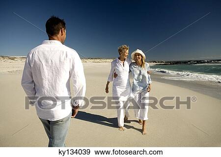 Couple and senior woman on the beach View Large Photo Image Stock Photo - Couple and senior woman on the beach. Fotosearch