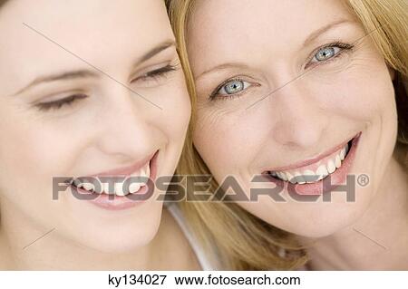 Portrait of two smiling women, indoors View Large Photo Image Stock Photo - Portrait of two smiling women, indoors. Fotosearch