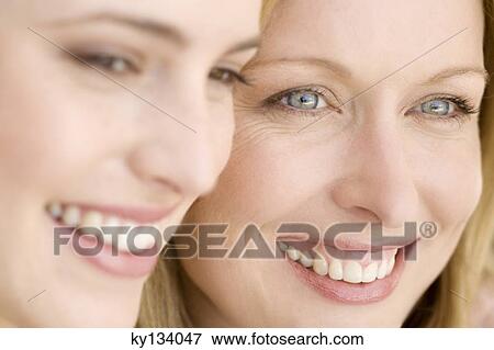 Portrait of two smiling women, indoors View Large Photo Image Stock Photo - Portrait of two smiling women, indoors. Fotosearch