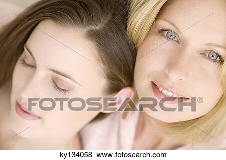 Portrait of two women, indoors View Large Photo Image Stock Photo - Portrait of two women, indoors. Fotosearch