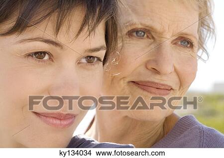 Senior woman and adult daughter, outdoors View Large Photo Image Picture - Senior woman and adult daughter, outdoors. Fotosearch