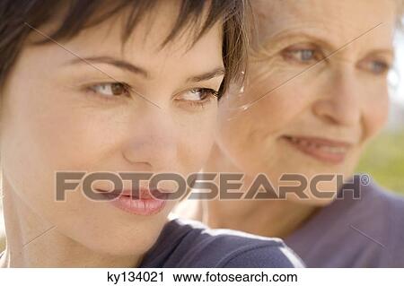 Senior woman and adult daughter, outdoors View Large Photo Image Stock Image - Senior woman and adult daughter, outdoors. Fotosearch